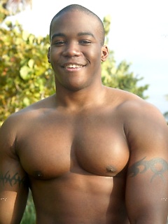 Muscular black dude teases with his insanely hot athletic body at the beach
