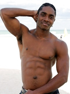 Sexy black guy with great abs and pecs goes shirtless outdoors