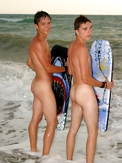 Twinks at the beach for body boarding fun in the nude and a bit of cock stroking